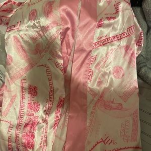 Pink Money patterned robe.